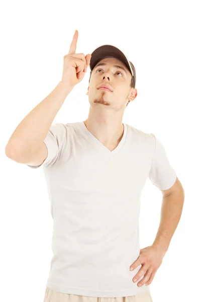 Young man is pointing and looking up — Stock Photo, Image