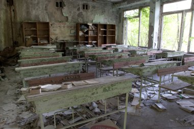 Chernobyl disaster results. This is classroom in abandoned school in small city Pripyat (about 5 kilometers form the Chernobyl nuclear station). clipart