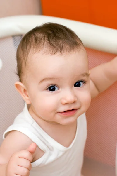 Fun caucasian baby in manege — Stock Photo, Image