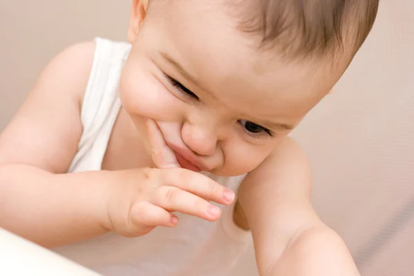 Fun caucasian baby with finger — Stock Photo, Image