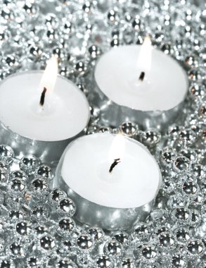 White candles with silver decoration balls clipart