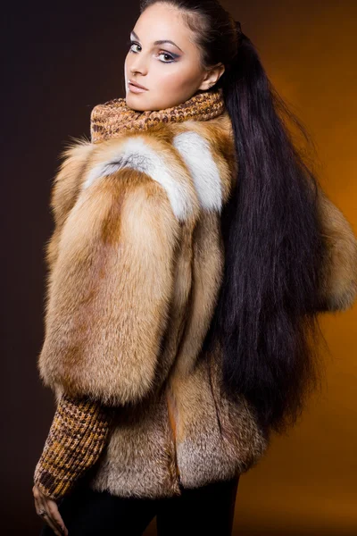 Beautiful woman in a fur coat Royalty Free Stock Photos