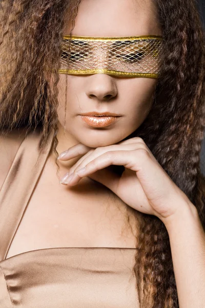 Elegant fashionable woman in golden dress — Stock Photo, Image