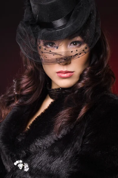 Elegant fashionable woman in a hat — Stock Photo, Image