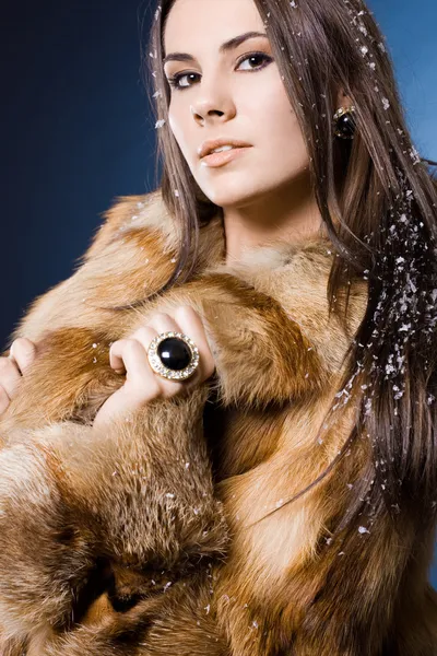 Beautiful woman in a fur coat — Stock Photo, Image