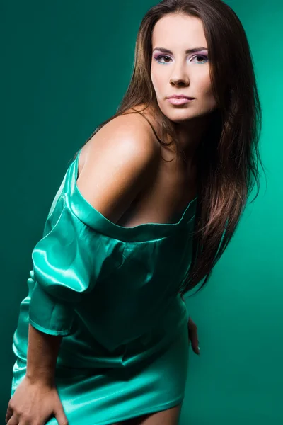 Fashionable woman on green background — Stock Photo, Image