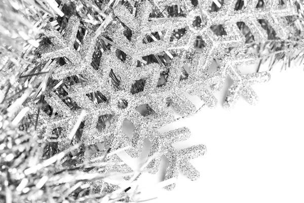 Christmas snowflake with festive garland — Stock Photo, Image