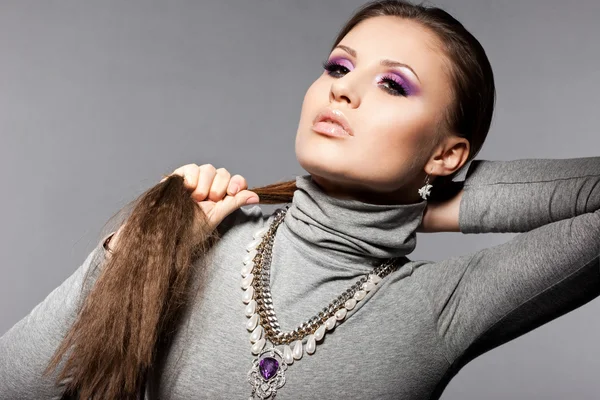 Elegant fashionable woman with violet visage — Stock Photo, Image