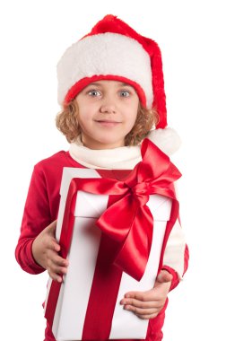 A small girl with a christmas hat and a present