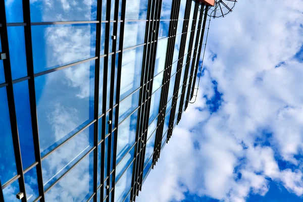 stock image Clouds in glazed panel skyscraper