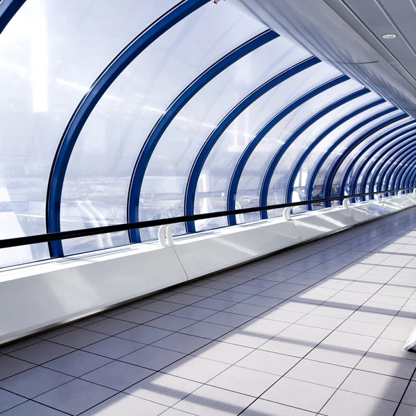 Glass clean tunnel with bent wall — Stock Photo, Image