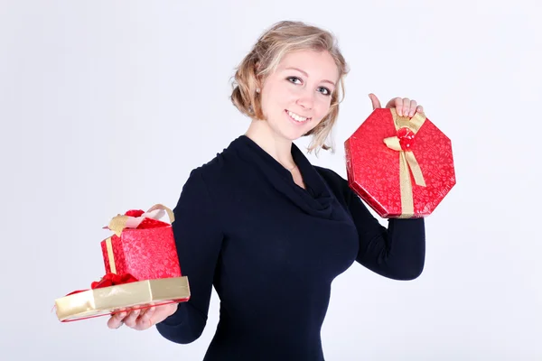 Attractive young girl with christmas vivid presents — Stock Photo, Image