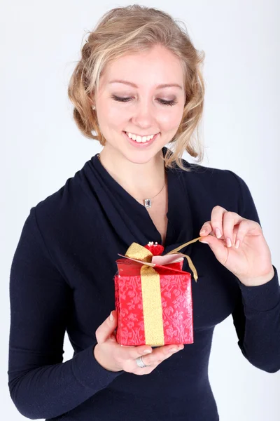 Attractive young girl with christmas vivid presents — Stock Photo, Image