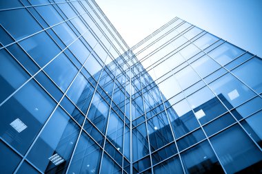 Modern glass silhouettes of skyscrapers at night clipart