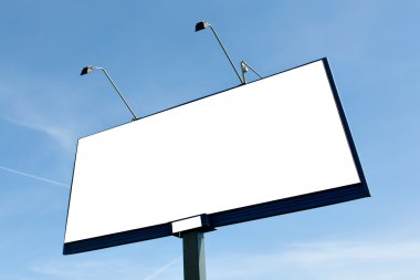 Empty blank billboard over bright blue sky