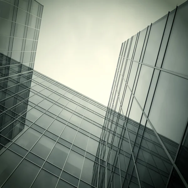 Moderne glas silhouetten van wolkenkrabbers in de nacht — Stockfoto