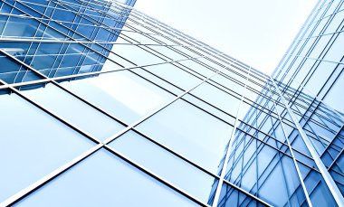 Modern blue glass skyscraper perspective view clipart