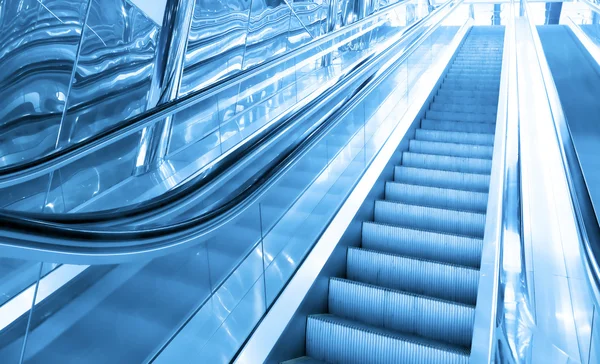 Modré Pohyblivý eskalátor — Stock fotografie