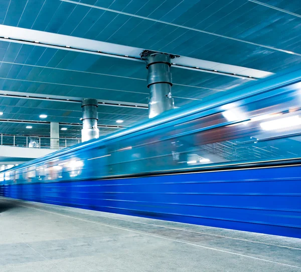Blue moving train with staircase — Stock Photo, Image