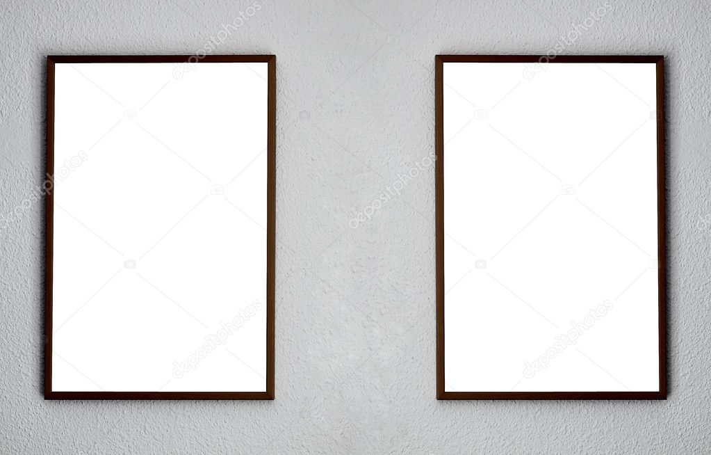 Empty two frames on white wall in the exhibition