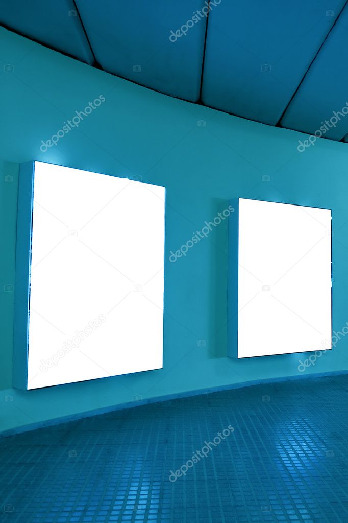 Empty frames on blue wall