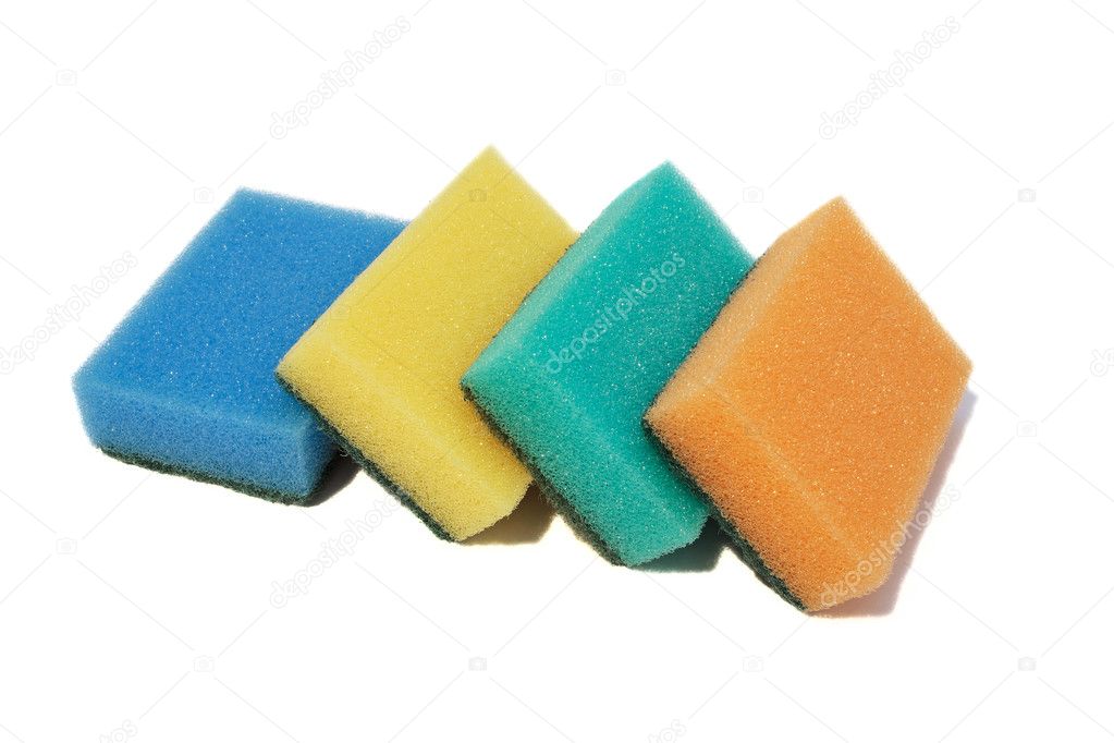 Multicolored sponges for washing dishes. Closeup, isolated on a white background.