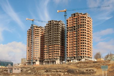 View of the unfinished new home in the city of Aktau. clipart