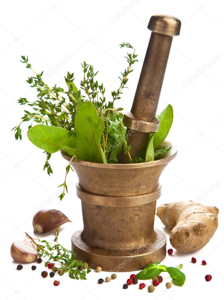 Mortar with herbs isolated