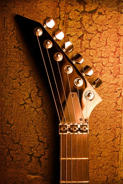 Top of guitar over grunge background — Stock Photo, Image