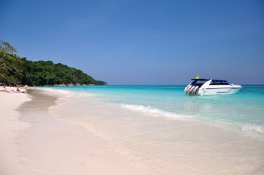 Motor boats on turquoise water of Indian Ocean clipart