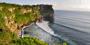 Rocky coast near Uluwatu temple on Bali clipart