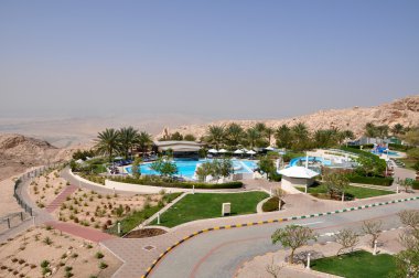 Swimming pool in hotel with view of mountains. Al Ain. UAE clipart