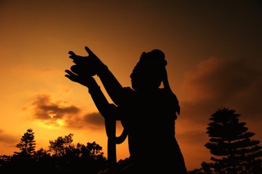 Buddhistic statue praising and making offerings to the Tian Tan Buddha (Hon clipart