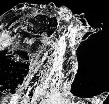 Stylish water splash. Isolated on black background clipart