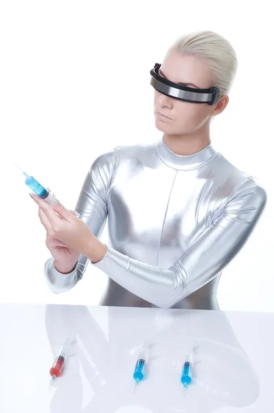 Cyber woman choosing syringe — Stock Photo, Image