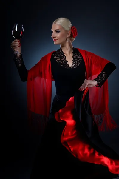 Beautiful flamenco dancer holding a glass of wine — Stock Photo, Image