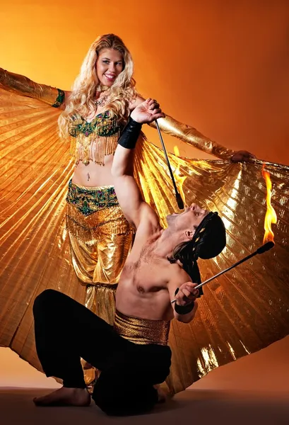 Arabic dancer with fire eater — Stock Photo, Image