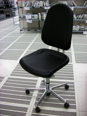 Black chair in a clean room clipart