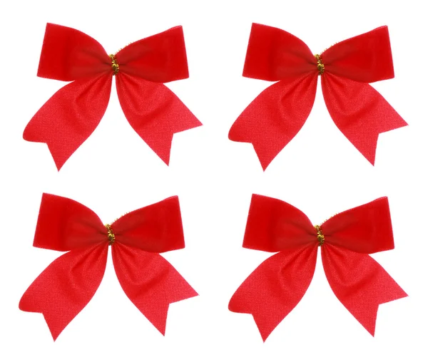 Čtyři vánoční červené luk na bílém pozadí — Stock fotografie