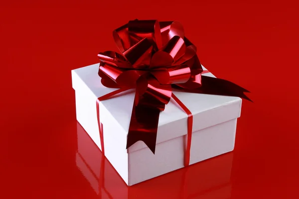 stock image Christmas gift box with a dark-red ribbon bow