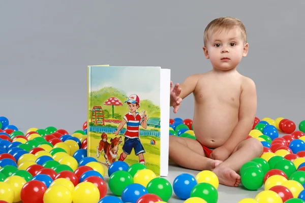 Kid with the colored balls — Stock Photo, Image