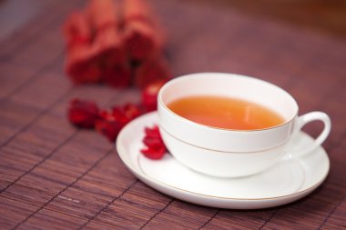 Black tea in a white cup on a dark background clipart