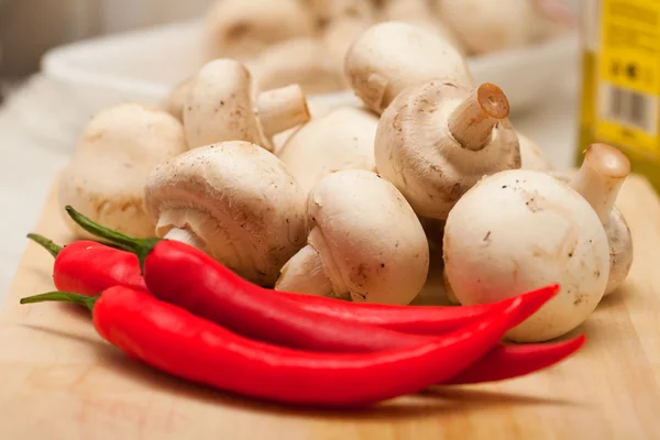 Red hot chili pepper and mushrooms — Stock Photo, Image
