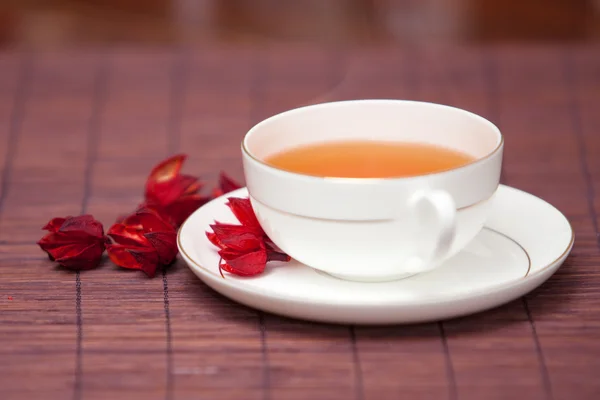 stock image Black tea in a white cup on a dark background