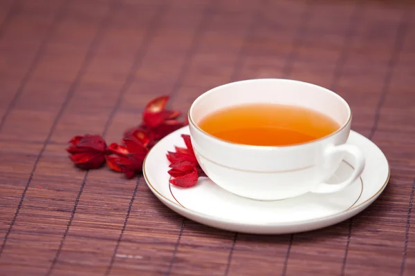 stock image Black tea in a white cup on a dark background