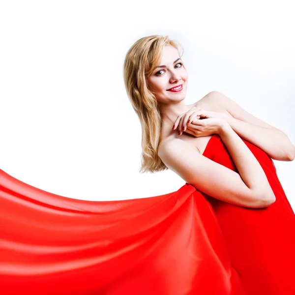 Rood, mooie blonde in een rode jurk — Stockfoto