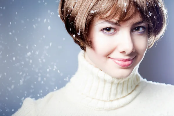 Young beautiful girl rejoices to snow — Stock Photo, Image