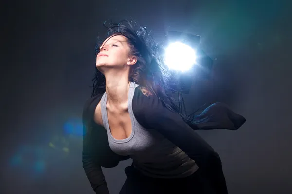 stock image To enjoy music, beautiful young girl dances