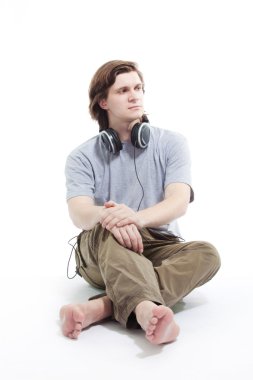 Young man listening music clipart