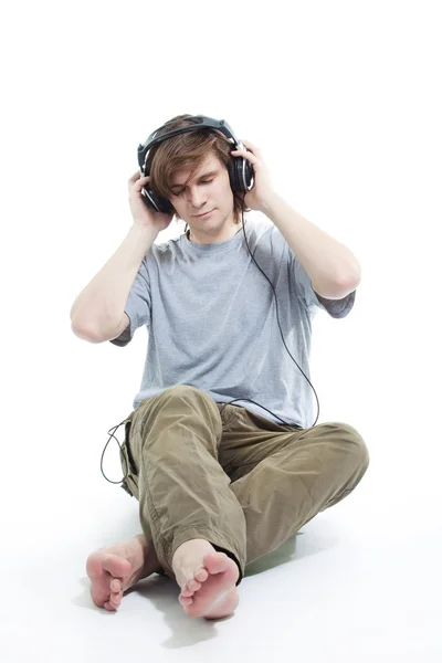 stock image Young man listening music